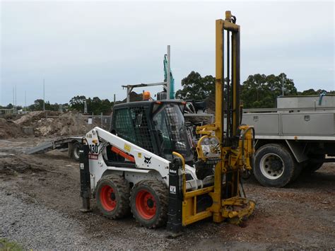 mini excavator with drill attachment|drilling rig attachments for bobcat.